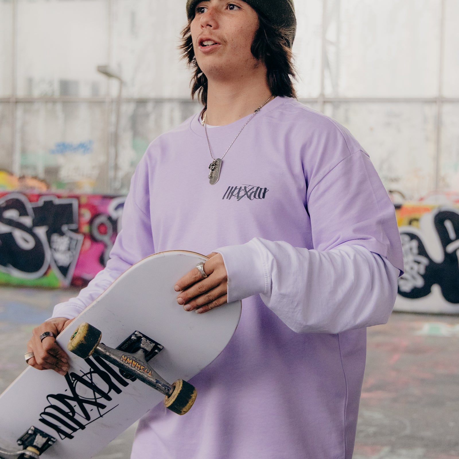 White skateboard deck with Maxolut logo detail.